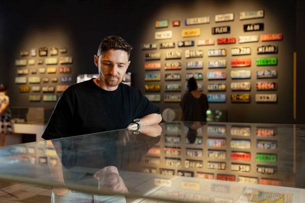 Drag performers posing in front of a 4WD displaying Pride decorations 2023, Photo by Josie Huang, Image no. 34001-0001-0009,  Acc. 34001 Pride Solidarity Convoy collection State Library of Queensland. 